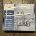 Home Impressions Two Handle Bathroom Faucet With Pop-up Drain 400690. Fixed Price $44.99.