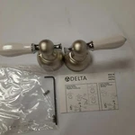 Delta H612NC Traditional Classic Porcelain Lever Handles Pearl Nickel/white. Fixed Price $70.00.